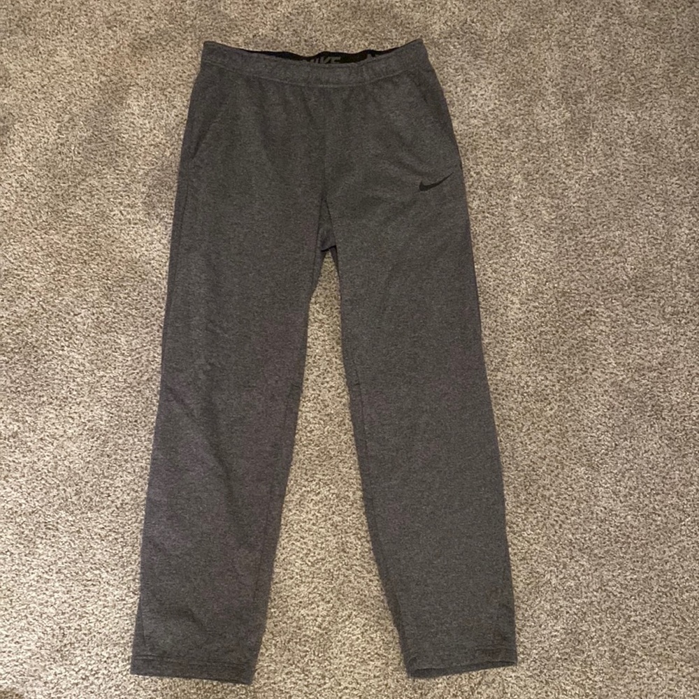Mens Nike Dri- Fit, fleece lined, with draw strings sweat pants.